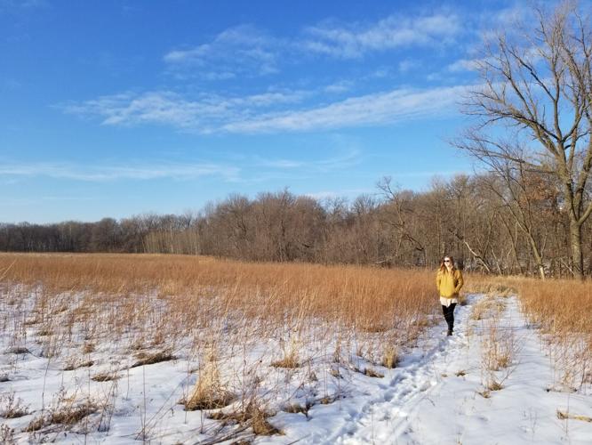 Visitor walks through Prairie Creek WMA during winter.